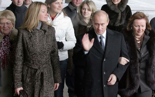 PHOTO: Russian President Vladimir Putin (C), his wife Ludmila (R) and daughter Maria (2ndL) enter a Moscow polling station, on Dec. 2, 2007, to cast their votes in Russia's parliamentary elections.  (Alexander Nemenov/AFP via Getty Images, FILE)