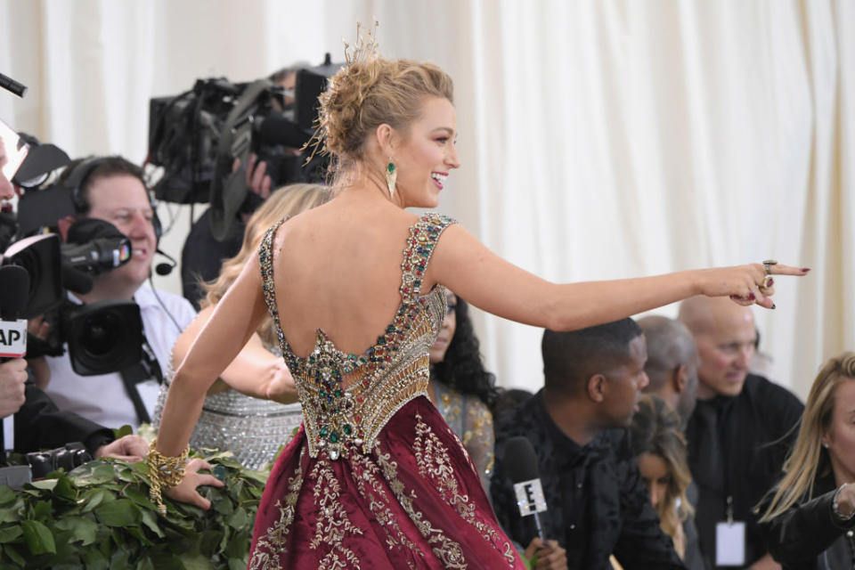 Blake Lively gets playful with photographers. (Photo: Getty Images)