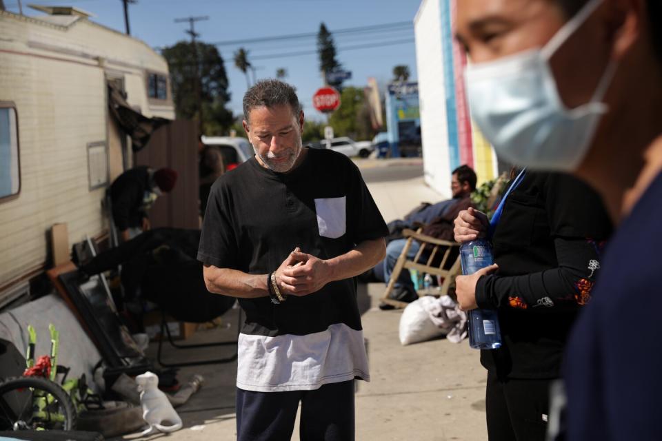 Manny Placeres is visited in North Hollywood by an L.A. County Department of Health Services medical team on March 7, 2022.