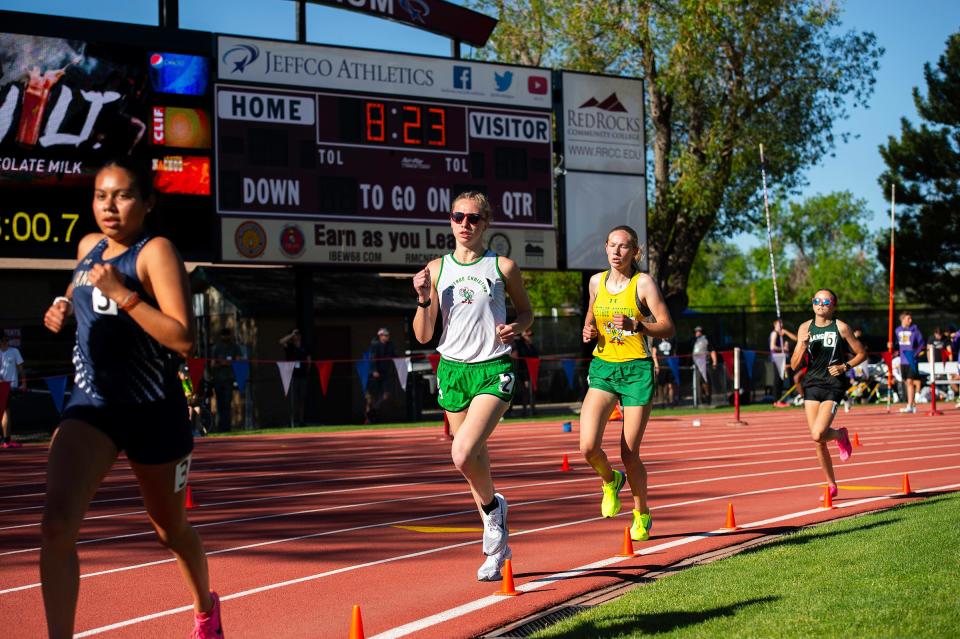 Heritage Christian's Lilly Lukens and Mikaela Kendall round out the early leaders pack of runners in a 2A girls 2-mile race during the Colorado track and field state championships on Friday, May 17, 2024 at Jeffco Stadium in Lakewood, Colo.