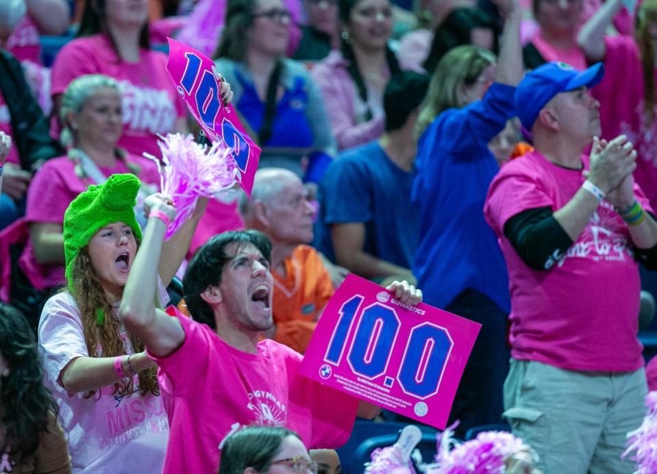 Fans celebrate Florida Gators gymnast Leanne Wong’s perfect 10 on the uneven parallel bars as Florida takes on Arkansas in an NCAA Gymnastics meet at Exactech Arena in Gainesville, FL on Friday, February 9, 2024. [Alan Youngblood/Gainesville Sun]