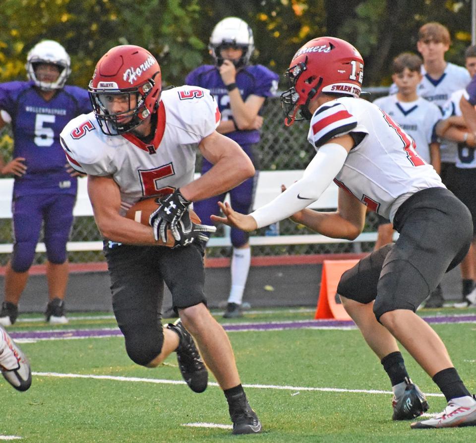 Max Mickel (5) of Honesdale takes the hand-off and is ready to make his move. Mickel has been named to the PFN First Team All-State squad for Class 4A.