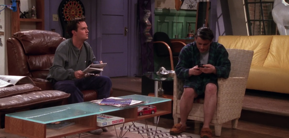 Chandler and Joey are surprised by what they find on their telly. (Netflix)