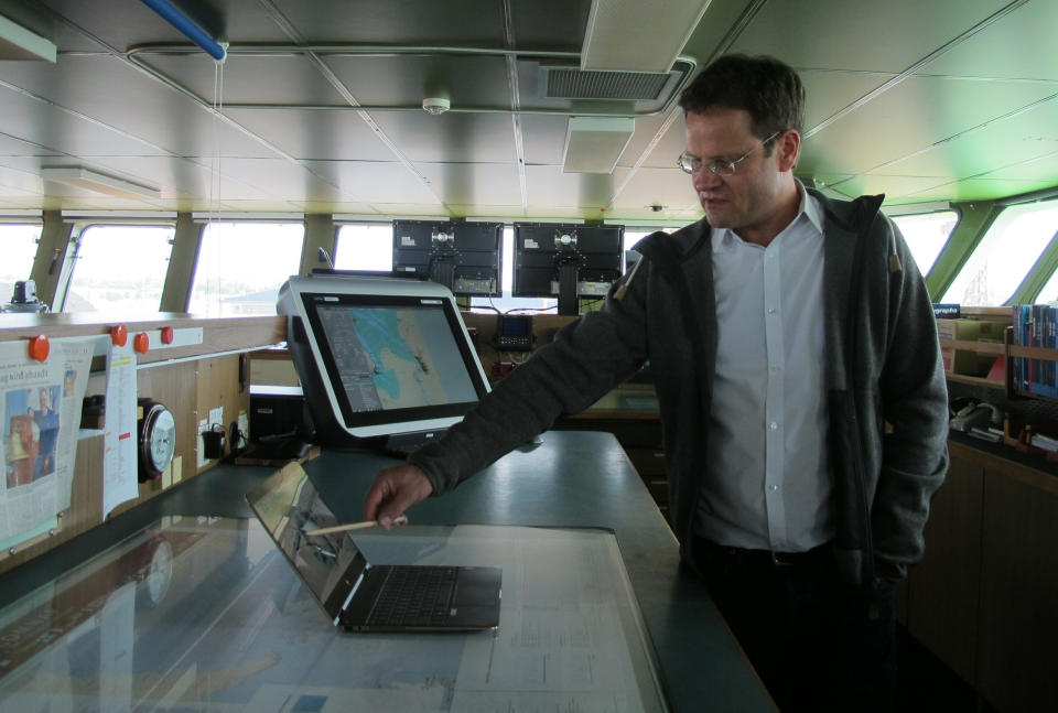 Markus Rex, an atmospheric scientist and leader of the MOSAiC expedition, stands on the bridge of the German Arctic research vessel Polarstern in Bremerhaven, Germany, Wednesday, July 3, 2019. Scientists from 17 nations are preparing for a year-long mission to the central Arctic to study the impact that climate change is having on the frigid far north of the planet. Mission leader Markus Rex said that researchers plan to anchor the German icebreaker RV Polarstern to a large floe and set up camp on the ice as the sea freezes around them, conducting experiments throughout the Arctic winter. (AP Photos/Frank Jordans)