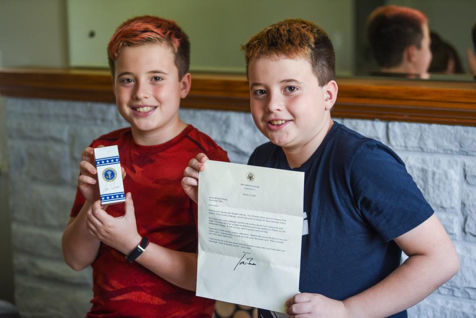 Twins Carter (left) and Nolan Neefus, 12, spent 10 minutes with President Joe Biden during his last visit to Cincinnati after writing letters to him. The twins recieved a letter back and an invitation to meet during President Biden's visit to United Performance Metals in Hamilton, Ohio on Friday May 6. After talking with the President, the twins recieved Secret Service pins as well as boxes of red, white and blue M&Ms in a special box with the President's signature on it.