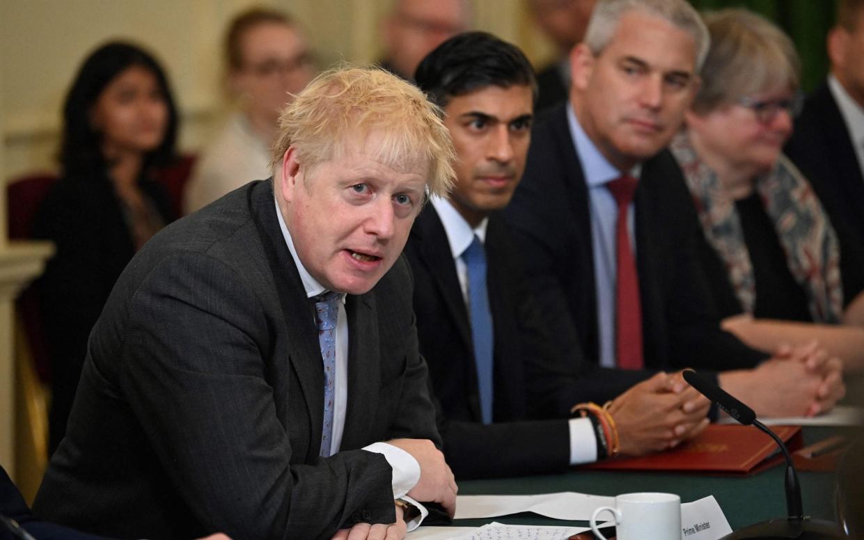Britain's Prime Minister Boris Johnson speaks during the first post-reshuffle cabinet meeting in Downing street, central London on September 17, 2021. Chancellor Rishi Sunak sits to his left. - BEN STANSALL/AFP