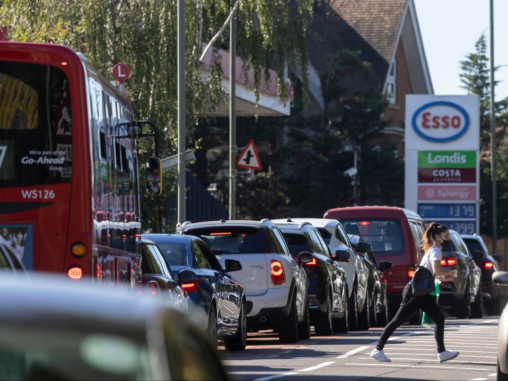 A queue forms for an Esso petrol station in London (Getty Images)