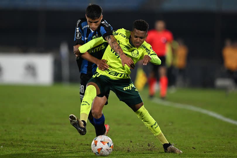 Liverpool's defender Agustin Cayetano (L) and Palmeiras' forward Estevao Willian fight for the ball during the Copa Libertadores group stage second leg football match between Uruguay's Liverpool and Brazil's Palmeiras, at the Centenario stadium in Montevideo, on May 9, 2024.