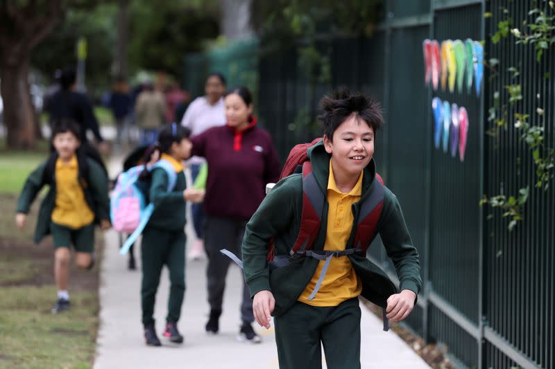 Children return to campus for the first day of New South Wales public schools fully re-opening in Sydney