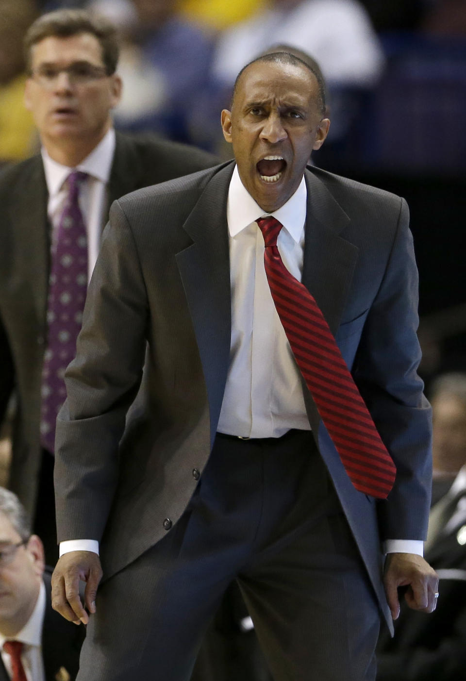 Stanford head coach Johnny Dawkins yells to his players during the second half of a second-round game in the NCAA college basketball tournament, Friday, March 21, 2014, in St. Louis. Stanford won the game 58-53. (AP Photo/Charlie Riedel)