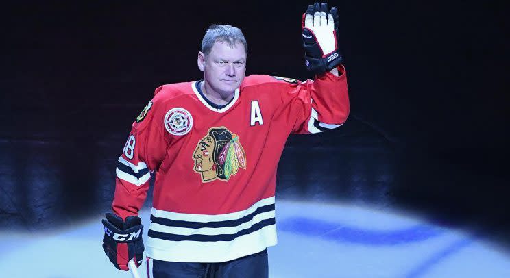 Former Chicago Blackhawks player Steve Larmer greets fans before the first period of an NHL hockey game between the Chicago Blackhawks and the New York Rangers on Friday Dec. 9, 2016, in Chicago. (AP Photo/Matt Marton)