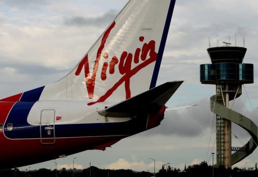 Etihad Airways chief James Hogan on Friday pledged the Abu Dhabi-based carrier will never seek control of Virgin Australia and hit out at Qantas's tactics to undermine his airline