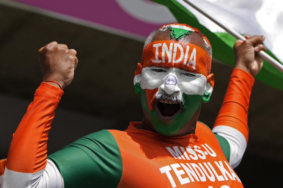 An Indian supporter cheers for his team ahead of the ICC Men's T20 World Cup cricket match between Afghanistan and India at Kensington Oval in Bridgetown, Barbados, Thursday, June 20, 2024. (AP Photo/Ricardo Mazalan)