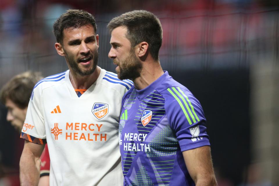 FC Cincinnati goalie Alec Kann, here being congratulated by defender Matt Miazga, made three vital saves to record his first victory in a regular-season match since early in the 2022.