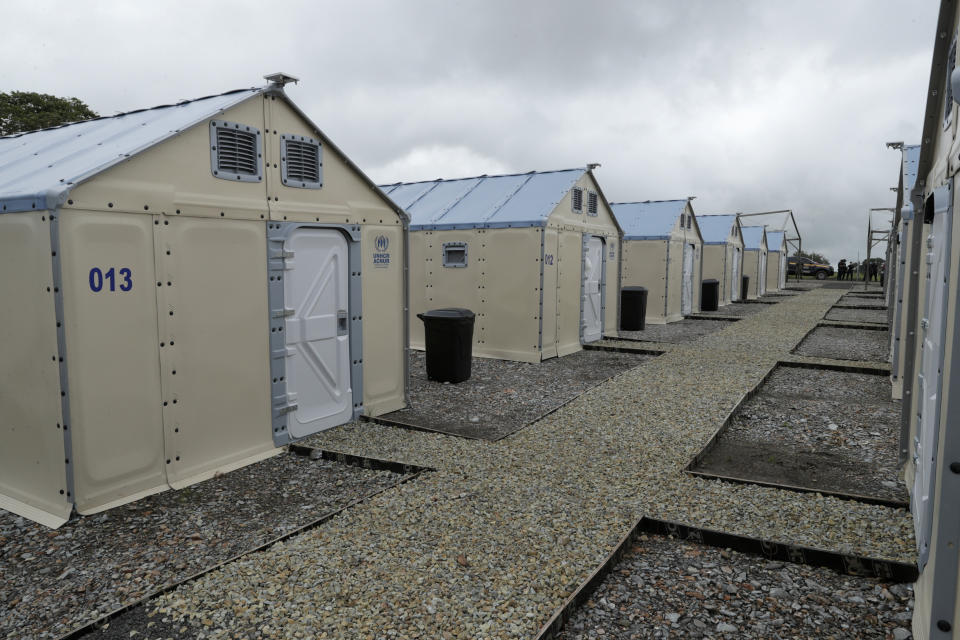 Brand new shelters for migrants stand ready to be occupied amid the new coronavirus pandemic, in San Vicente, Darien province, Panama, Saturday, Aug. 29, 2020. The new shelters will house at least 400 migrants, most of them families with children. (AP Photo/Arnulfo Franco)