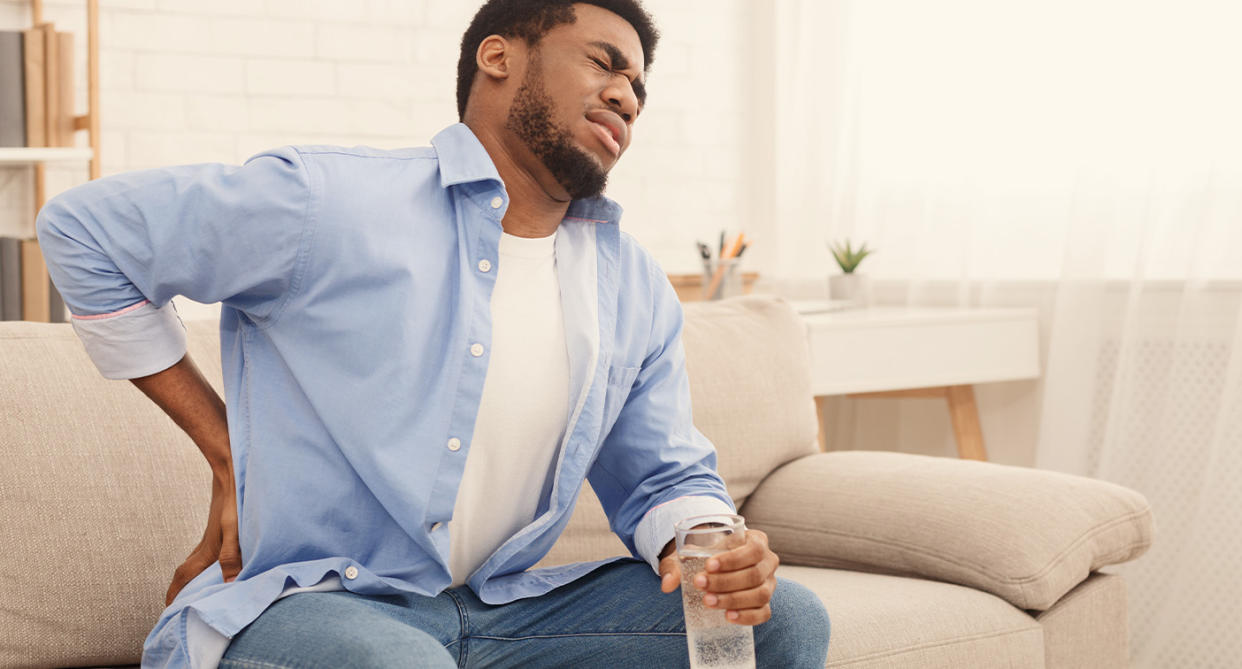 Man with back pain. (Getty Images)