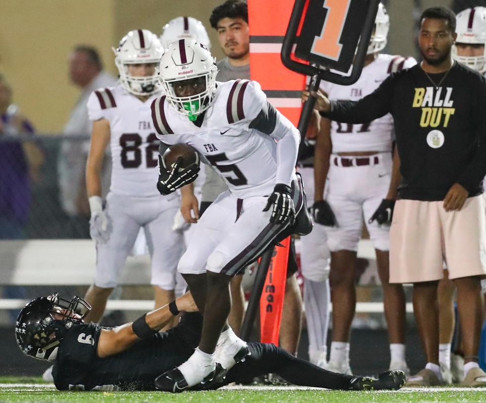 The Golden Gate Titans compete against the First Baptist Academy Lions in a game at Golden Gate High School in Naples on Friday, Sept. 29, 2023. The Lions won 48-46.