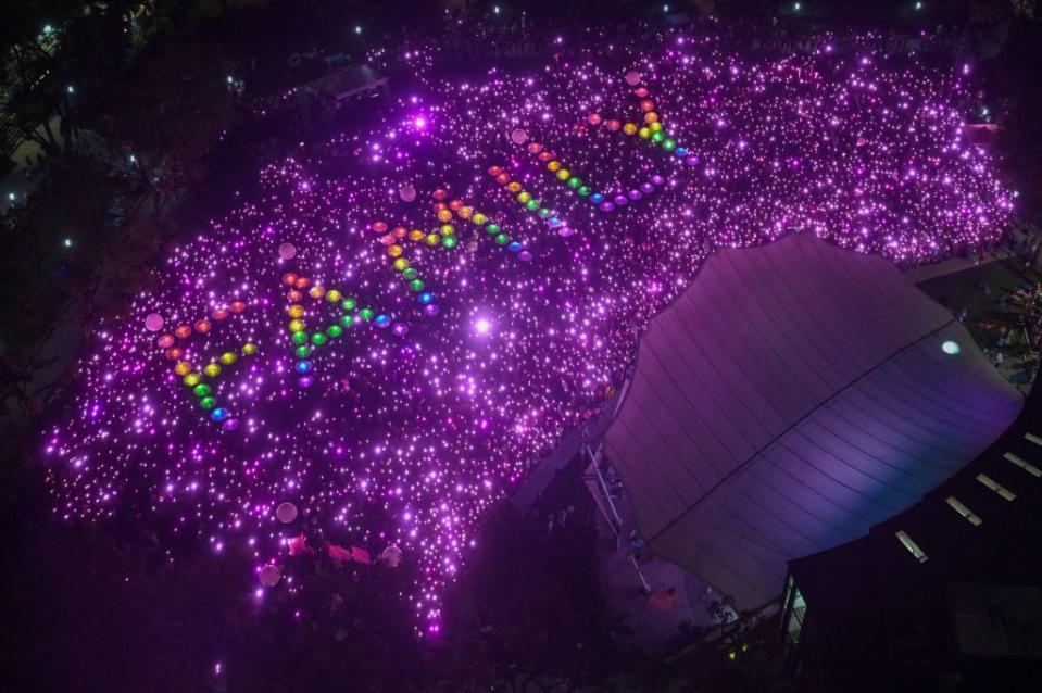 Thousands of Pink Dot attendees illuminate the word 'Family' at Hong Lim Park in Singapore on June 24, 2023.<span class="copyright">Roslan Rahman—AFP/ Getty Images</span>