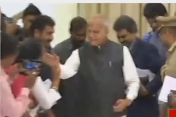The moment Banwarilal Purohit touched the journalist's cheek was caught on camera: CNN