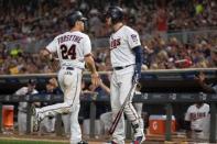 Aug 16, 2018; Minneapolis, MN, USA; Minnesota Twins second baseman Logan Forsythe (24) celebrates with Minnesota Twins catcher Mitch Garver (23) after scoring during the sixth inning against the Detroit Tigers at Target Field. Jordan Johnson-USA TODAY Sports