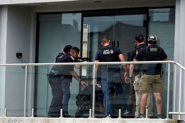 PHOTO: Law enforcement search in a building after a mass shooting at the Highland Park Fourth of July parade in downtown Highland Park, a Chicago suburb on Monday, July 4, 2022. (Nam Y. Huh/AP)