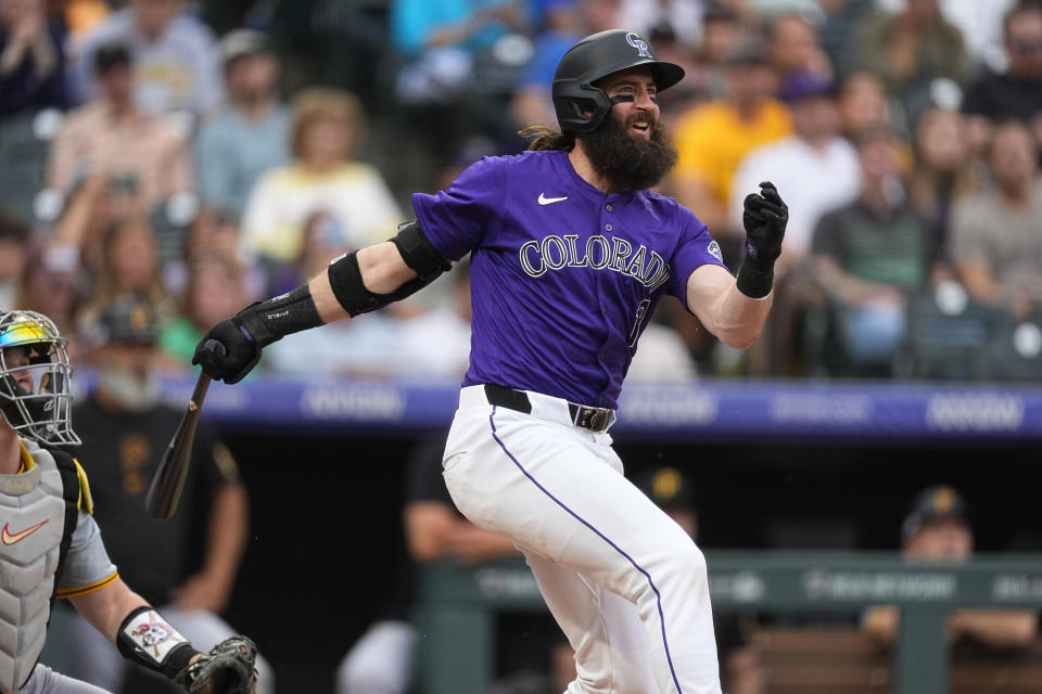 Colorado Rockies' Charlie Blackmon doubles against Pittsburgh Pirates relief pitcher Luis L. Ortiz in the third inning of a baseball game Friday, June 14, 2024, in Denver. (AP Photo/David Zalubowski)