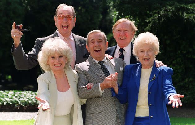 Veteran Carry On film stars Jack Douglas (back left), Leslie Phillips (right rear), Barbara Windsor (front left) and June Whitfield with guest and comic actor Norman Wisdom, centre, (who did not star in any of the films) (Photo: Fiona Hanson - PA Images via Getty Images)