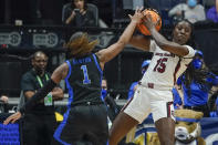 South Carolina's Laeticia Amihere (15) protects the ball from Kentucky's Robyn Benton (1) in the first half of the NCAA women's college basketball Southeastern Conference tournament championship game Sunday, March 6, 2022, in Nashville, Tenn. (AP Photo/Mark Humphrey)