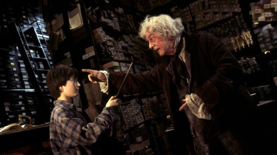 Daniel Radcliffe and John Hurt in "Harry Potter and Sorcerer's Stone."  - Warner Bros./Alamy Stock Photo