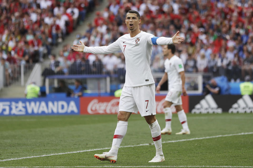 FILE - Portugal's Cristiano Ronaldo, center, reacts during the group B match between Portugal and Morocco at the 2018 soccer World Cup in the Luzhniki Stadium in Moscow, Russia, Wednesday, June 20, 2018. (AP Photo/Matthias Schrader, File )