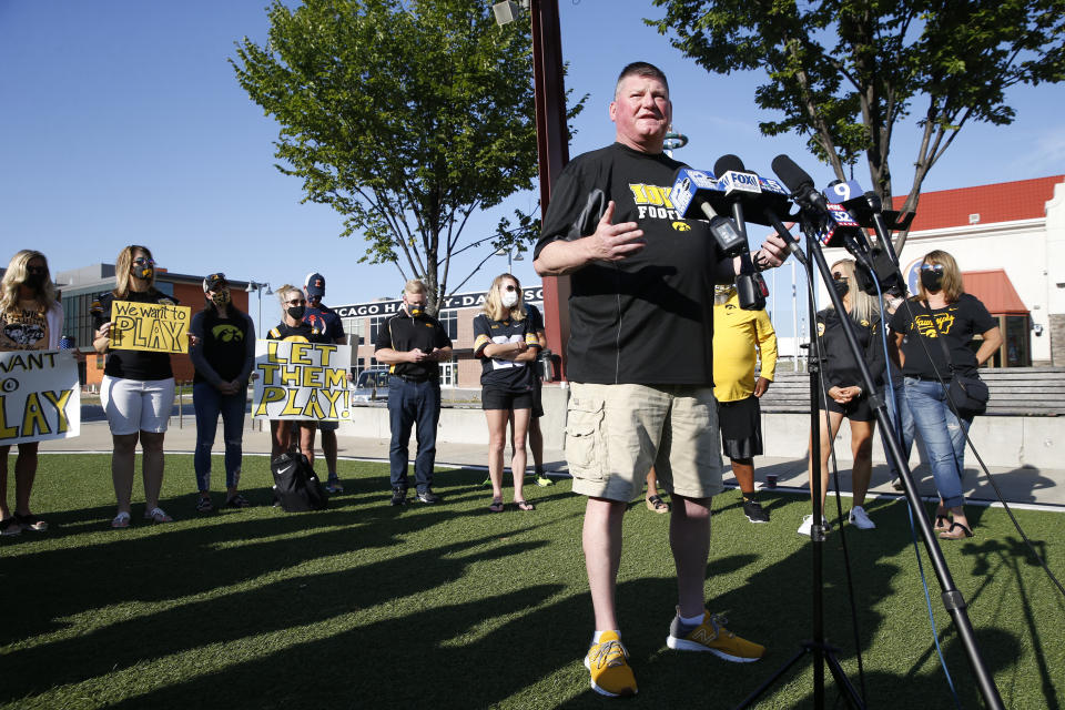 Jay Kallenberger, parent of two University of Iowa football players, speaks at a press conference asking for more transparency and communication by the Big Ten outside of their headquarters on Friday, August 21, 2020 in Rosemont. Parents of Big Ten football players, upset over the process that led to the postponement of the season until spring, held a protest near the conference's Chicago-area headquarters Friday while an attorney in Nebraska demanded commissioner Kevin Warren turn over material illustrating how the decision was made. (Stacey Wescott/Chicago Tribune via AP)