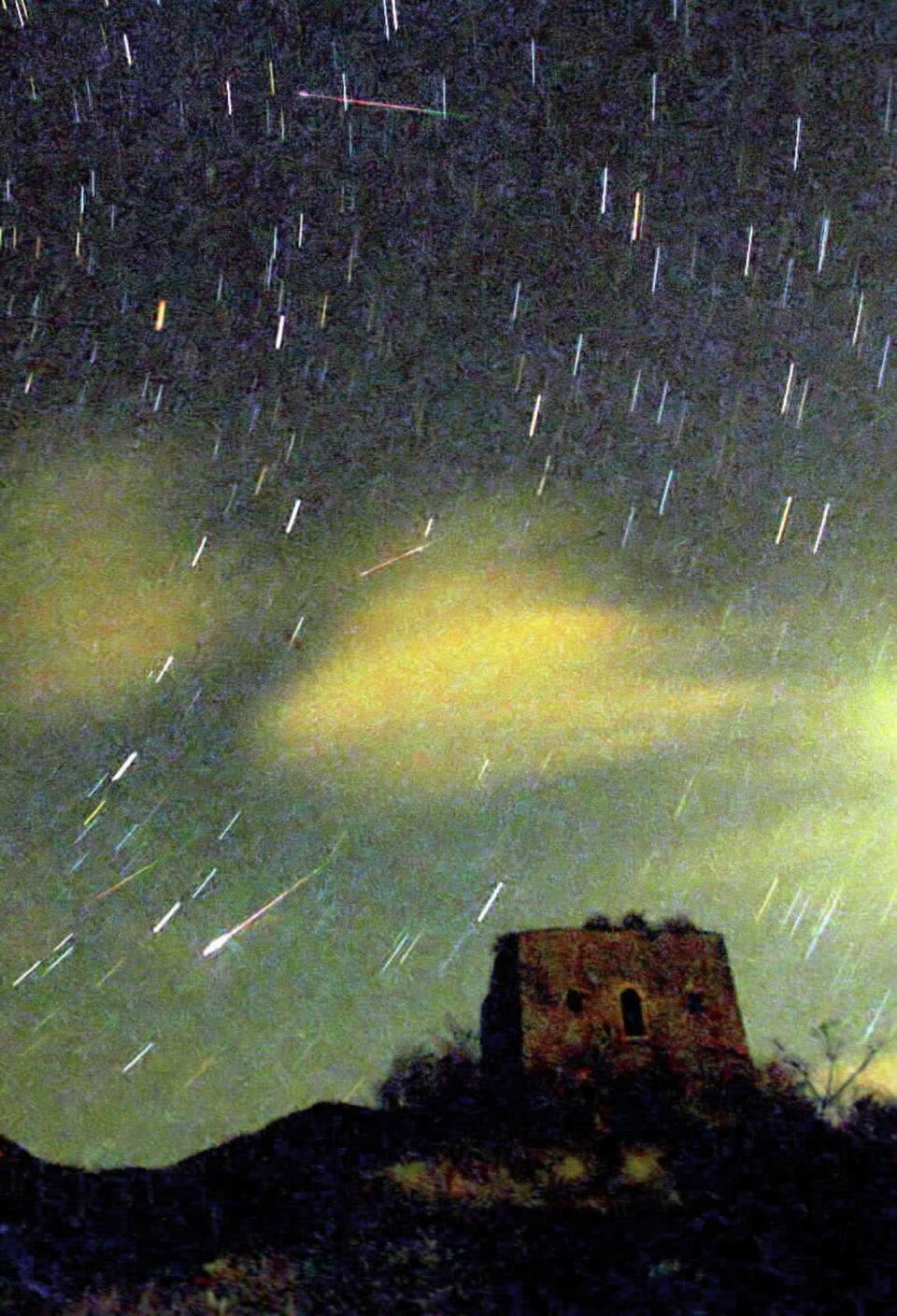 Colorful streaks of meteors are seen in the sky of the suburbs of Beijing on Monday, Nov. 19, 2001. The Leonids meteor shower occured in Beijing, Nanjing and other places in the early morning of Nov. 19. (AP Photo/Xinhua, Li Jundong)