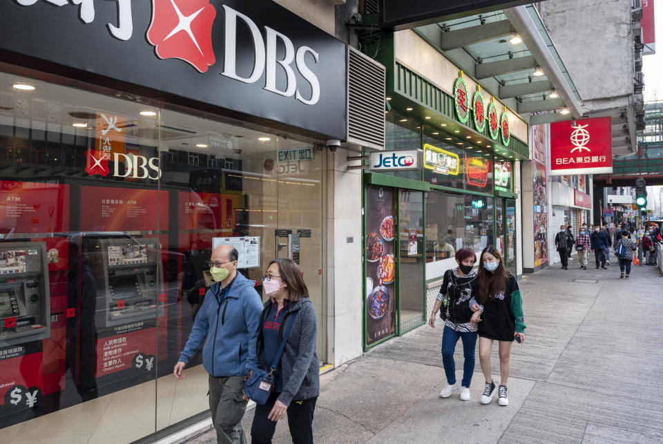 HONG KONG, CHINA - 2021/03/09: Pedestrians walk past an investment bank and financial services corporation, DBS branch seen in Hong Kong. (Photo by Chukrut Budrul/SOPA Images/LightRocket via Getty Images)