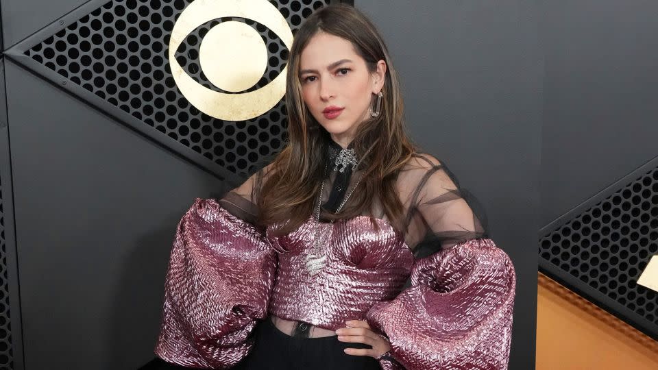 Mexican singer and songwriter Paty Cantú’s look featured a sheer skirt with reflective pink bodice and sleeves. - Jordan Strauss/Invision/AP