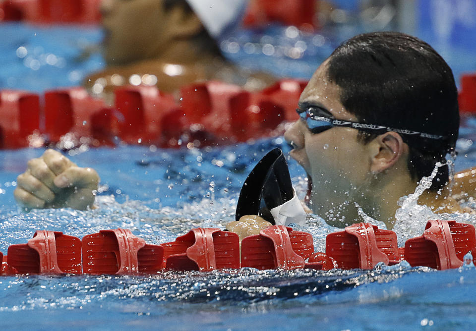 Joseph Schooling celebrates winning a race at the SEA Games.