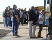 Students are escorted from Berrendo Middle School following an early morning shooting in Roswell, New Mexico, January 14, 2014. REUTERS/Mark Wilson/Roswell Daily Record