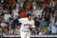 Houston Astros' Jason Castro celebrates after walking with the bases loaded to score Carlos Correa during the ninth inning of a baseball game against the Tampa Bay Rays Tuesday, Sept. 28, 2021, in Houston. The Astros won 4-3. (AP Photo/David J. Phillip)