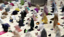 In this photo taken using slow shutter speed, Muslim women offer an evening prayer called "tarawih" marking the first eve of the holy fasting month of Ramadan at Istiqlal Mosque in Jakarta, Indonesia. Monday, April 12, 2021. During Ramadan, the holiest month in Islamic calendar, Muslims refrain from eating, drinking, smoking and sex from dawn to dusk. (AP Photo/ Achmad Ibrahim)