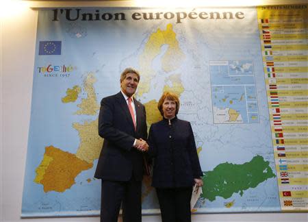 U.S. Secretary of State John Kerry (L) shakes hands with European Union foreign policy chief Catherine Ashton before their meeting with Iranian Foreign Minister Mohammad Javad Zarif (not pictured) in Geneva, November 8, 2013. REUTERS/Jason Reed