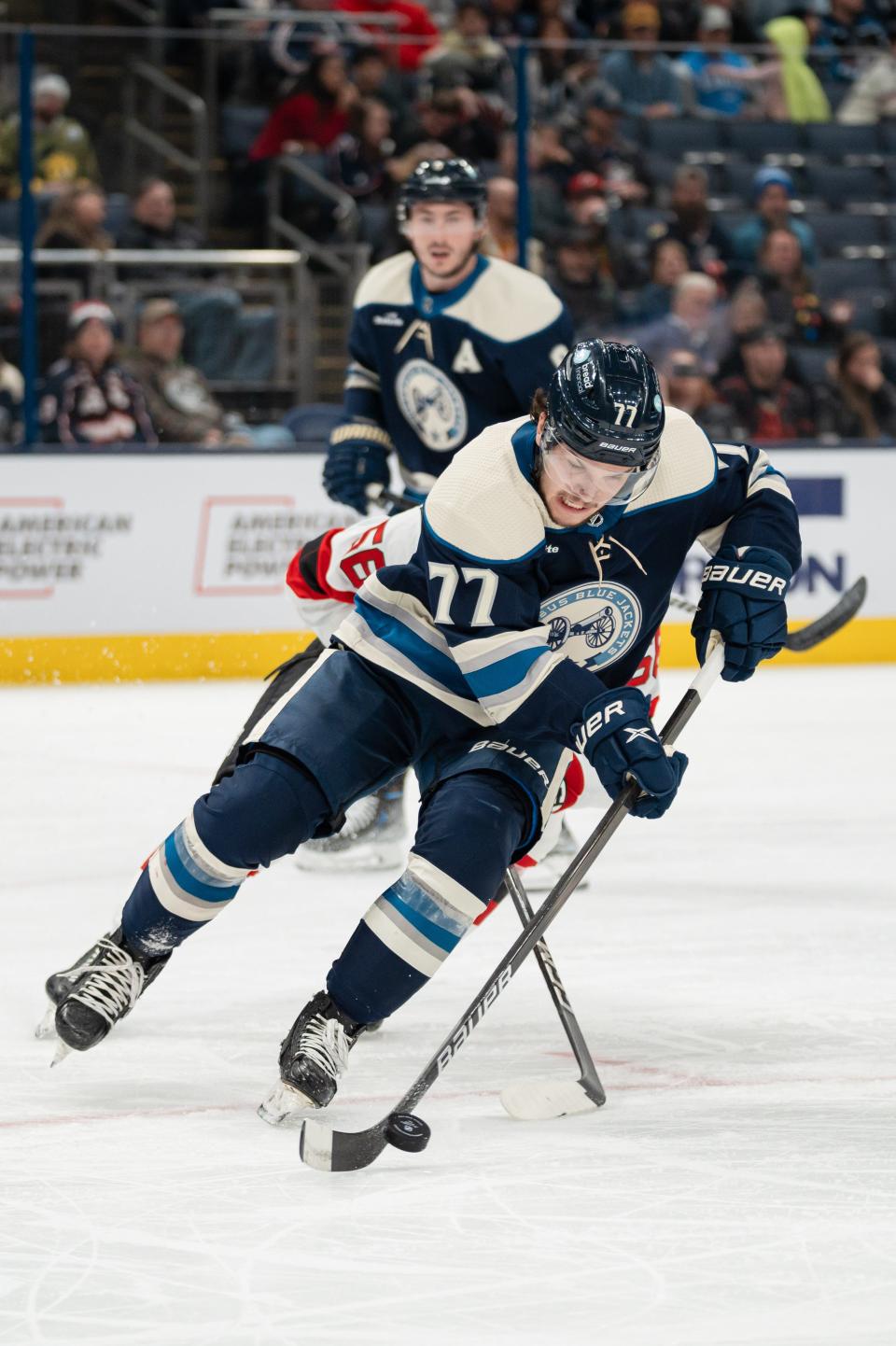 Dec 16, 2023; Columbus, Ohio, USA;
Columbus Blue Jackets defenseman Nick Blankenburg (77) brings the puck down the rink during the second period of their game against the New Jersey Devils on Saturday, Dec. 16, 2023 at Nationwide Arena.