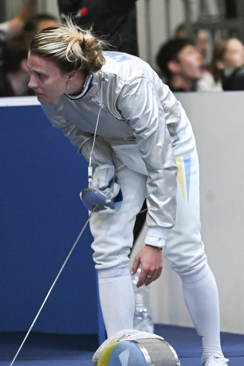 Ukraine's Olga Kharlan leaves after her bout with Russia's Anna Smirnova in the women's individual sabre best of 64 round match, during the FIE World Fencing Championship, in Milan, Italy, Thursday, July 27, 2023. Olympic champion Kharlan competed against officially-neutral Russian opponent Smirnova at the world fencing championships, an Olympic qualifier, on Thursday in Milan, Italy, winning their bout 15-7. However, Smirnova refused to leave after the bout in an apparent protest because Kharlan refused to shake hands at the end. (Tibor Illyes/MTI via AP)