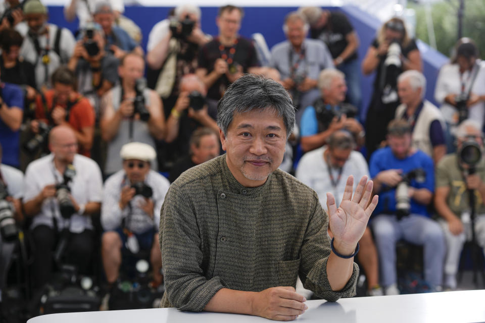 Director Hirokazu Koreeda poses for photographers at the photo call for the film 'Broker' at the 75th international film festival, Cannes, southern France, Friday, May 27, 2022. (AP Photo/Petros Giannakouris)