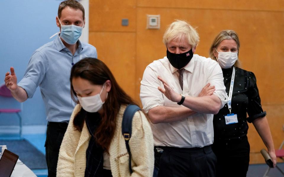 Prime Minister Boris Johnson visits a Covid-19 vaccination centre at Little Venice Sports Centre, in London  - Matt Dunham/Pool via Reuters