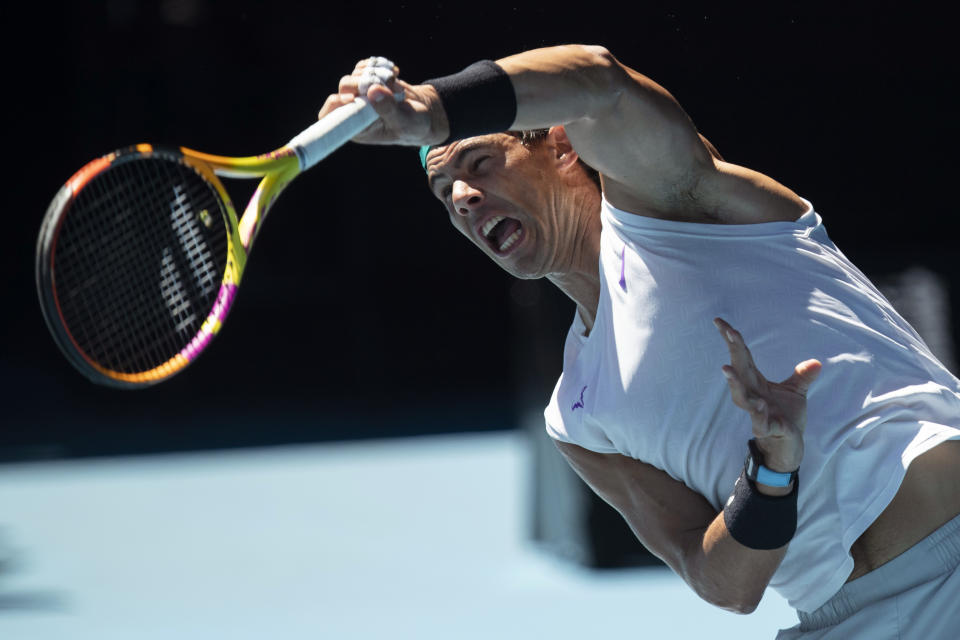 Spain's Rafael Nadal hits a return during practice on Rod Laver Area ahead of the Australian Open tennis championships on Sunday, Jan. 16, 2022, in Melbourne, Australia. (AP Photo/Simon Baker)