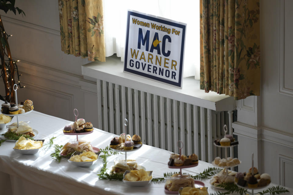 A sign is displayed at a campaign event for West Virginia gubernatorial candidate Mac Warner at the Charleston Women's Club in Charleston, W.Va., Thursday, May 4, 2023. (AP Photo/Jeff Dean)