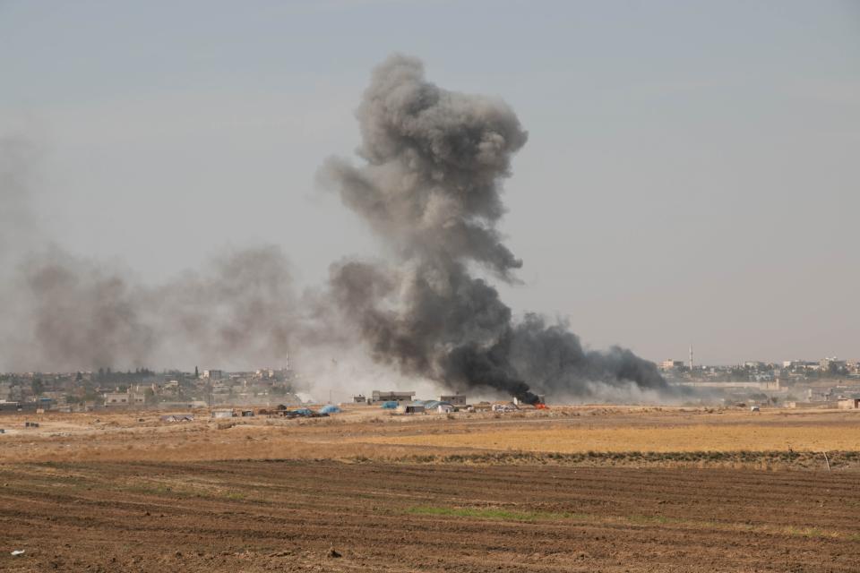 RAS AL-AYN, SYRIA - OCTOBER 12: Smoke rises after Members of Syrian National Army (SNA) continuing their operation as they hit terror targets in Syria's Ras al-Ayn to clear the town from PKK terror group and the Syrian Kurdish YPG militia, which Turkey regards as terror group, following entering the territory east of Euphrates River in northern Syria, to support Turkey's Operation Peace Spring, in Ras al-Ayn, Syria on October 12, 2019. (Photo by Huseyin Nasir/Anadolu Agency via Getty Images)