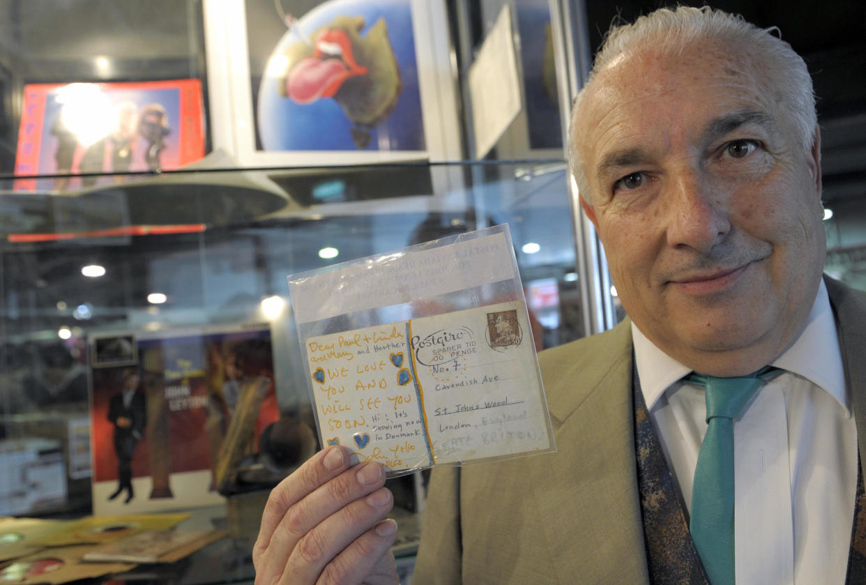 Spanish Mikel Barsa, creator of the record fair, shows in Buenos Aires on August 7, 2009, a post card signed by Beatles' UK musician John Lennon (1940-1980) and his wife Yoko Ono sent from Denmark in 1968 to Beatles' UK musician Paul McCartney. The post card will be auctioned on August 8 at the First International Record Fair. During three days people can buy, sell, exchange or bid for vinyl records, CDs, DVDs, and all kind of music related objects. AFP PHOTO / Juan Mabromata (Photo credit should read JUAN MABROMATA/AFP via Getty Images)