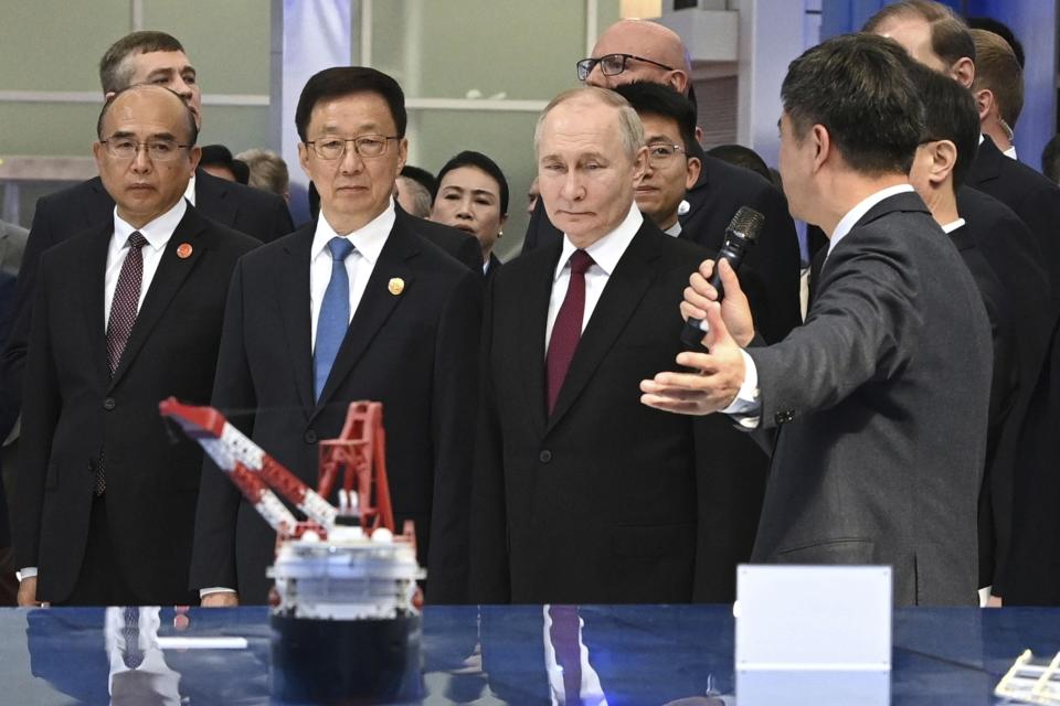 Russian President Vladimir Putin, second right, and Chinese Vice President Han Zheng, second left, visit the Russian-Chinese EXPO in Harbin, northeastern China's Heilongjiang Province, on Friday, May 17, 2024. (Sergei Bobylev, Sputnik, Kremlin Pool Photo via AP)