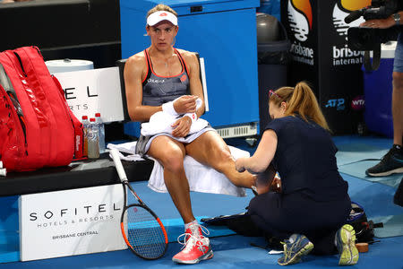 Tennis - Brisbane International - Women's Final - Pat Rafter Arena, Brisbane, Australia, January 6, 2019 Ukraine's Lesia Tsurenko receives medical attention during her match against Czech Republic's Karolina Pliskova REUTERS/Patrick Hamilton