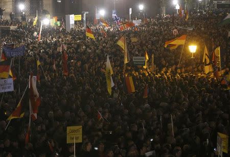 People gather for an anti-immigration demonstration organised by rightwing movement Patriotic Europeans Against the Islamisation of the West (PEGIDA) in Dresden, Germany October 19, 2015. REUTERS/Fabrizio Bensch